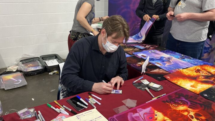 Steve Argyle signs artwork for fans